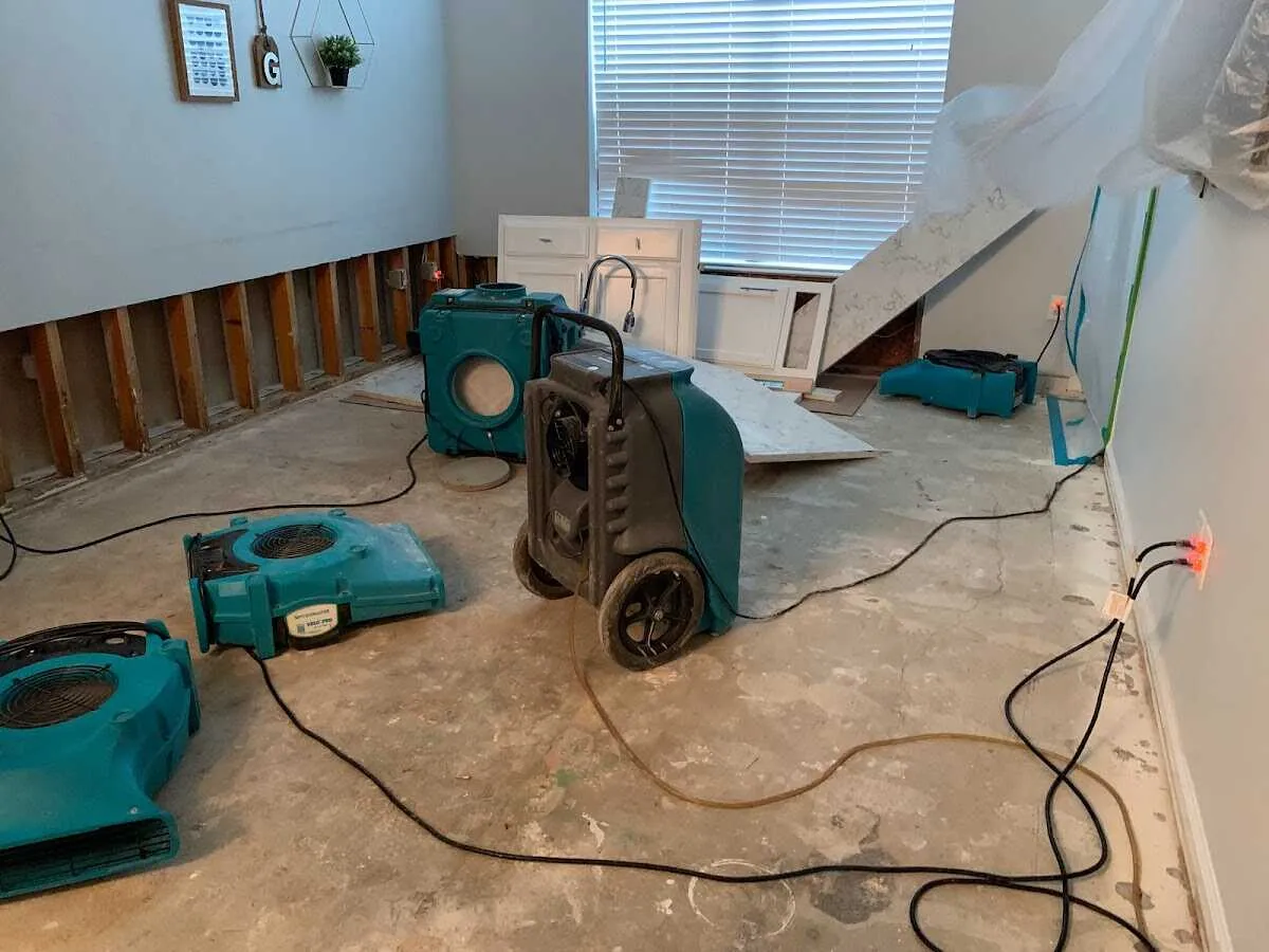Dehumidifier in flood-cut room for Water Damage Restoration in Muscle Shoals